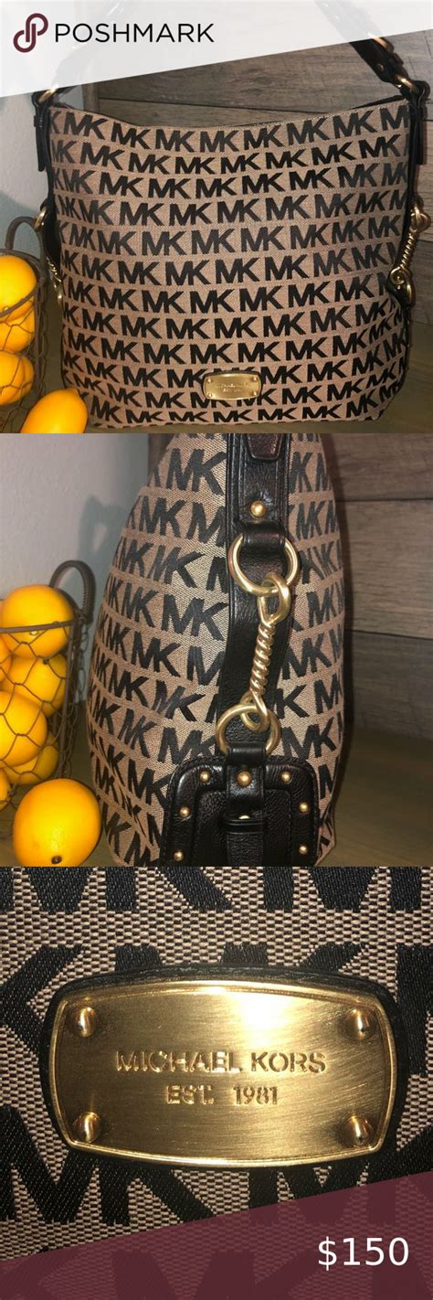 Authentic MICHAEL KORS EST. 1981 Signature Bag .